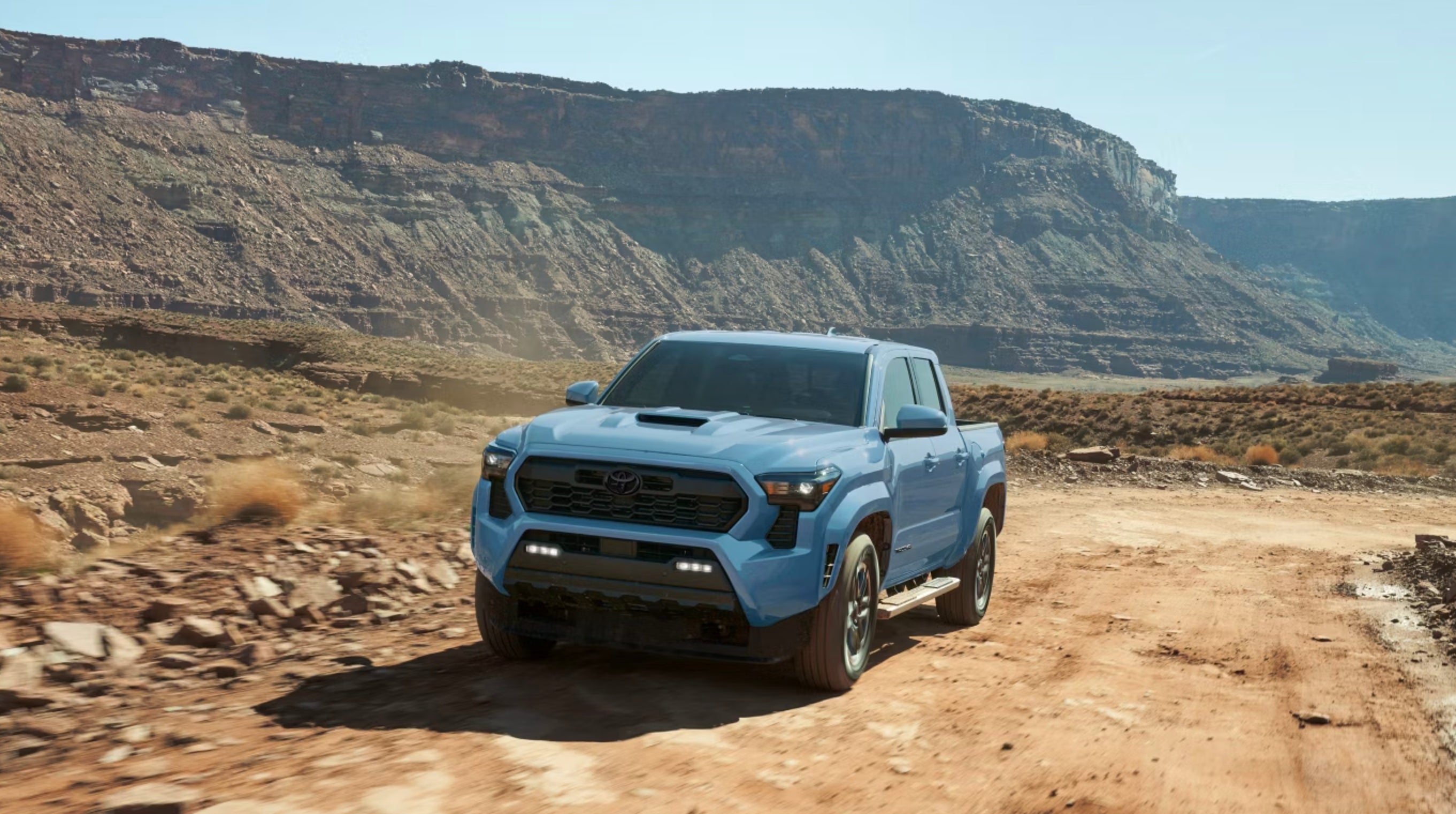 2026 Toyota Tacoma TRD Sport shown in Heritage Blue with available side step accessory for sale in Parkersburg, WV